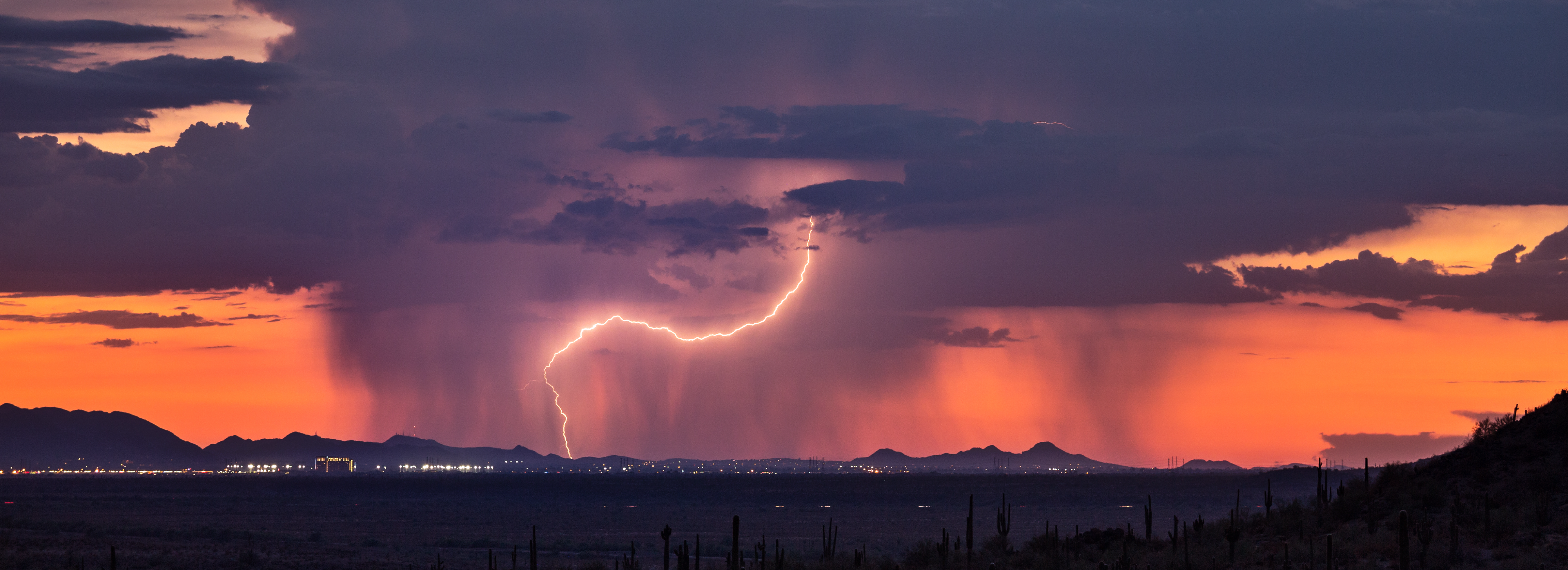 Thunderstorm over Phoenix, Arizona at sunset. Monsoon thunderstorm with lightning over Phoenix, Arizona at sunset.
