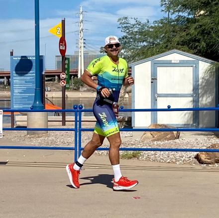 Nick Valverde running around the shores of Tempe Town Lake.
