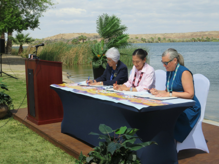 CRIT Chairwoman Amelia Flores, U.S. Secretary of the Interior Deb Haaland and Arizona Governor Katie Hobbs sign historic water-marketing agreement. Photo credit: John Wright, Parker Pioneer.