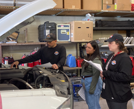 Nick Valverde instructing how to jump start a vehicle