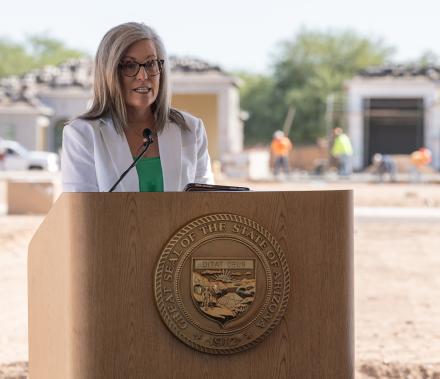 Governor Katie Hobbs speaking at the celebratory gathering at a new housing development on the far west side of metropolitan Phoenix. Photo courtesy of George Tenney Photography