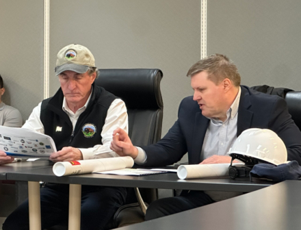 ADWR Deputy Director Clint Chandler discussing details of a graph with U.S. Secretary of the Interior Doug Burgum